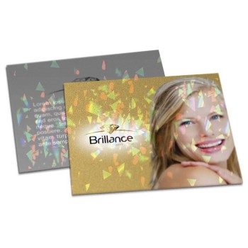 POSTAIS COUCHÊ 300G LAMINAÇÃO HOLOGRÁFICA LAM HOLOGRÁFICA FRENTE E VERSO 182X153MM Colorido frente e preto e branco verso - 100 un.